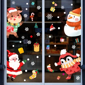 Detail of Christmas window stickers with Santa, reindeer and snowman on glass