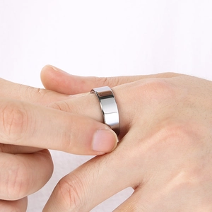 Polished silver stainless steel ring for men with smooth mirror finish on model's hand