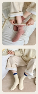 Detail view of ribbed wool blend crew socks in pink and beige for autumn and winter