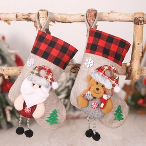 Christmas burlap stockings with Santa and bear cartoons, red and black plaid cuffs