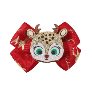 Détail du nœud de Noël rouge avec imprimé renne doré et tête de renne à paillettes