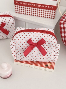 Quilted heart print pouch with red ribbon bow and ruffle trim decoration