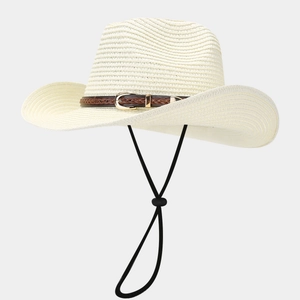 Close-up of woven straw hat texture with brown leather belt buckle and black windproof cord