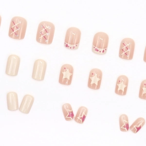 Short square press-on nails with sweet pink cow print and silver glitter stars