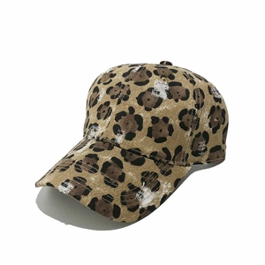 Close-up of leopard print baseball cap with distressed torn detailing and vintage finish