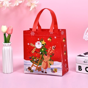 Reusable Christmas non-woven gift bag with Santa Claus and reindeer print in red