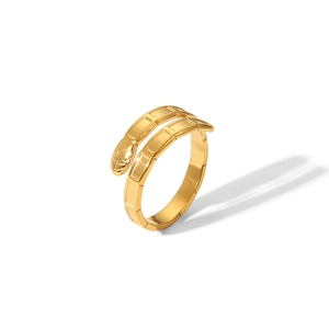 Detailed view of the gold snake-shaped open ring featuring a geometric segmented design