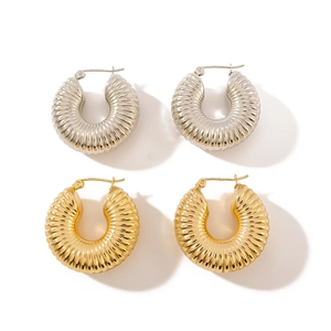 Pair of thick gold and silver twist hoop earrings with hollow croissant shape design