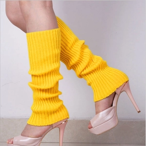 Close-up of yellow ribbed knit leg warmers showing thick texture and vertical pattern