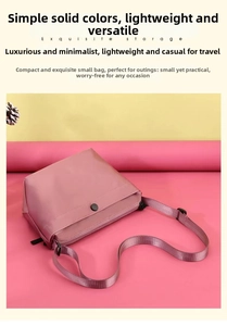 Exquisite storage pink nylon crossbody bag with adjustable wide black strap
