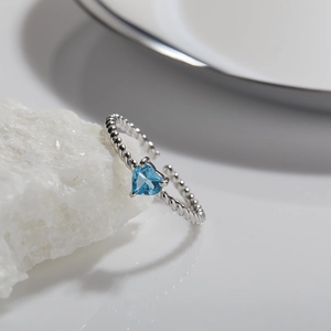 925 silver open heart ring with blue topaz and twisted rope band on white stone