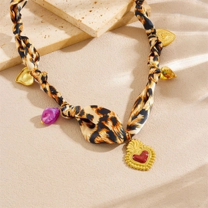Leopard print silk scarf necklace with a golden red heart pendant and colorful beads