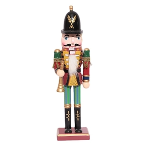Classic wooden nutcracker soldier ornament with red uniform and gold horn on white background
