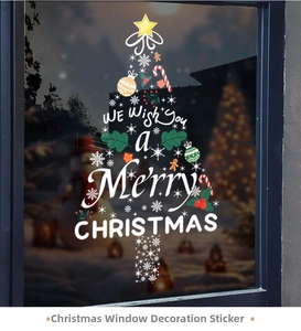 Detail of Christmas tree window sticker with snowflakes and candies on glass door
