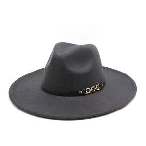 Detail of dark grey wool felt hat with black leather band and gold metal chain link decoration