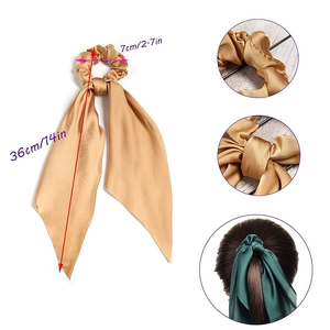 Satin silk hair scrunchie with long scarf streamers in gold and emerald green colors