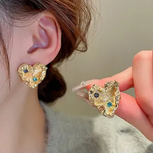 Vintage gold heart earrings with wrinkled texture and colorful sparkling rhinestones