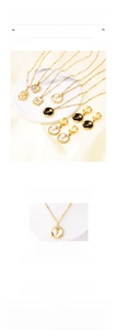 Detail showing titanium steel rose necklaces and earrings set with shell heart pendants
