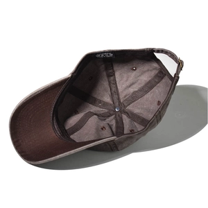 Detailed interior of washed cotton baseball cap showing stitching and fabric label