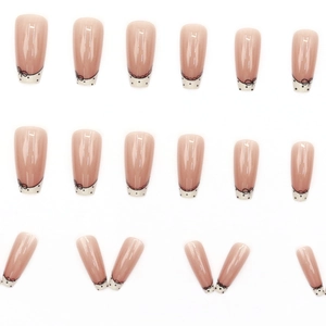 French tip press-on nails with black polka dots and bows on nude base, 24-piece set