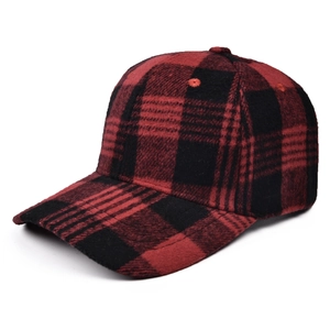 Close-up of red and black buffalo plaid baseball cap with thick flannel texture detail