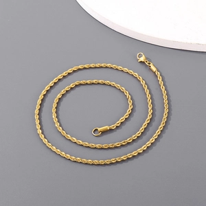 Close-up of golden stainless steel rope chain necklace with classic lobster clasp
