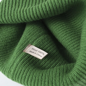 Grass green wool knit hat made of 100% thick wool with a ribbed texture for winter