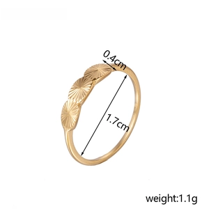 Detailed view of golden ring featuring three scalloped textures and size dimensions