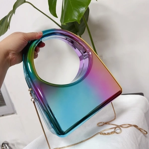 Rainbow gradient acrylic handbag with round cutout handle and gold metal chain strap