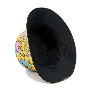 Reversible bucket hat with yellow duck print and solid black side for sun protection