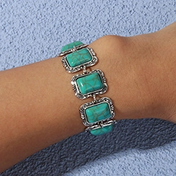 Macro detail of bohemian vintage silver bracelet with rectangular turquoise stones