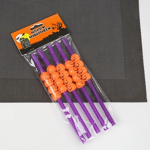 Detail view of 4-pack Halloween pumpkin straws with purple ripple texture and jack-o-lantern beads