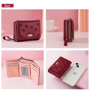 Detail of red short wallet with floral embroidery, card slots and zipper pocket