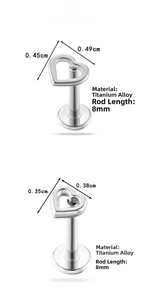 Detail of titanium hollow heart labret studs with 8mm bar length and silver finish