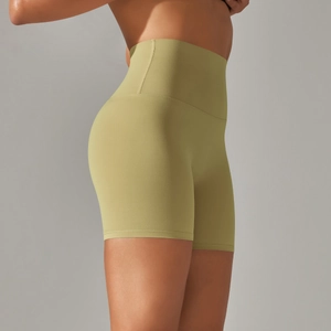 Detailed back view of high-waisted olive green yoga shorts showing peach lift effect