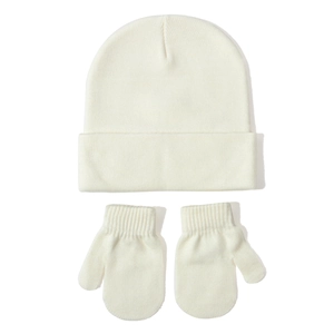 Detailed view of soft white knitted baby beanie hat and matching warm mittens set