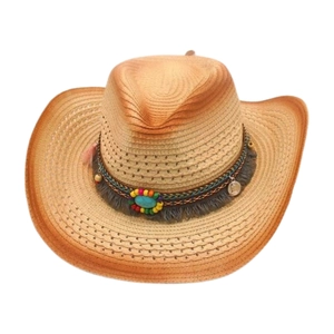 Detail of bohemian straw cowboy hat featuring turquoise stone, beads, and fringe trim