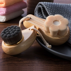Detailed close-up of soft fiber bristles and natural wooden handles of facial cleansing brushes