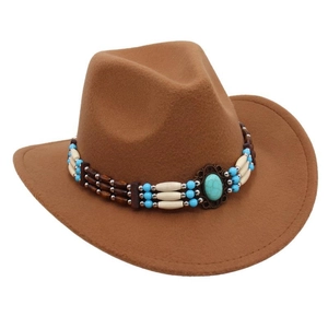 Detail of western cowboy hat featuring boho turquoise bead band on brown felt texture