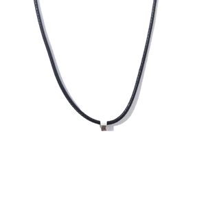 Detailed close-up of a durable black cord necklace with a polished metal clasp