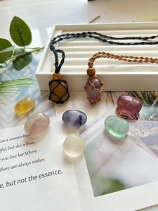 Detail of adjustable mesh net necklace holders with various natural polished gemstones