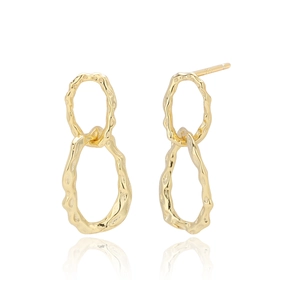 Detail of golden S925 silver double hoop earrings with a unique hammered texture finish