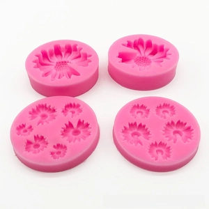 Detail view of four-piece pink daisy silicone molds with intricate floral petal textures