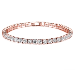Macro shot of rose gold tennis bracelet with brilliant round cut cubic zirconia stones