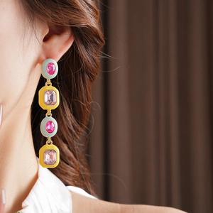 Model wearing vintage style long tassel earrings with colorful enamel and inlaid rhinestones