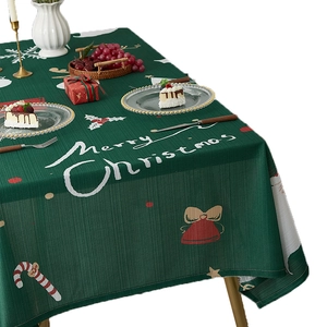 Festive dark green Christmas tablecloth with white Merry Christmas print and holiday motifs
