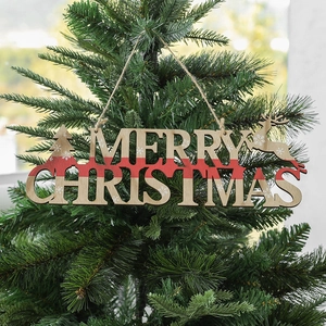 Wooden Merry Christmas hanging ornament with reindeer and tree on a festive tree branch