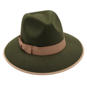Detail of dark green wool fedora hat featuring khaki ribbon and bound edge brim