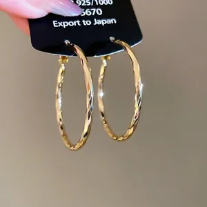 14k gold plated large twisted hoop earrings with faceted 925 silver texture for women