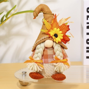 Detail showing autumn gnome doll with sunflowers, maple leaves and braided hair texture